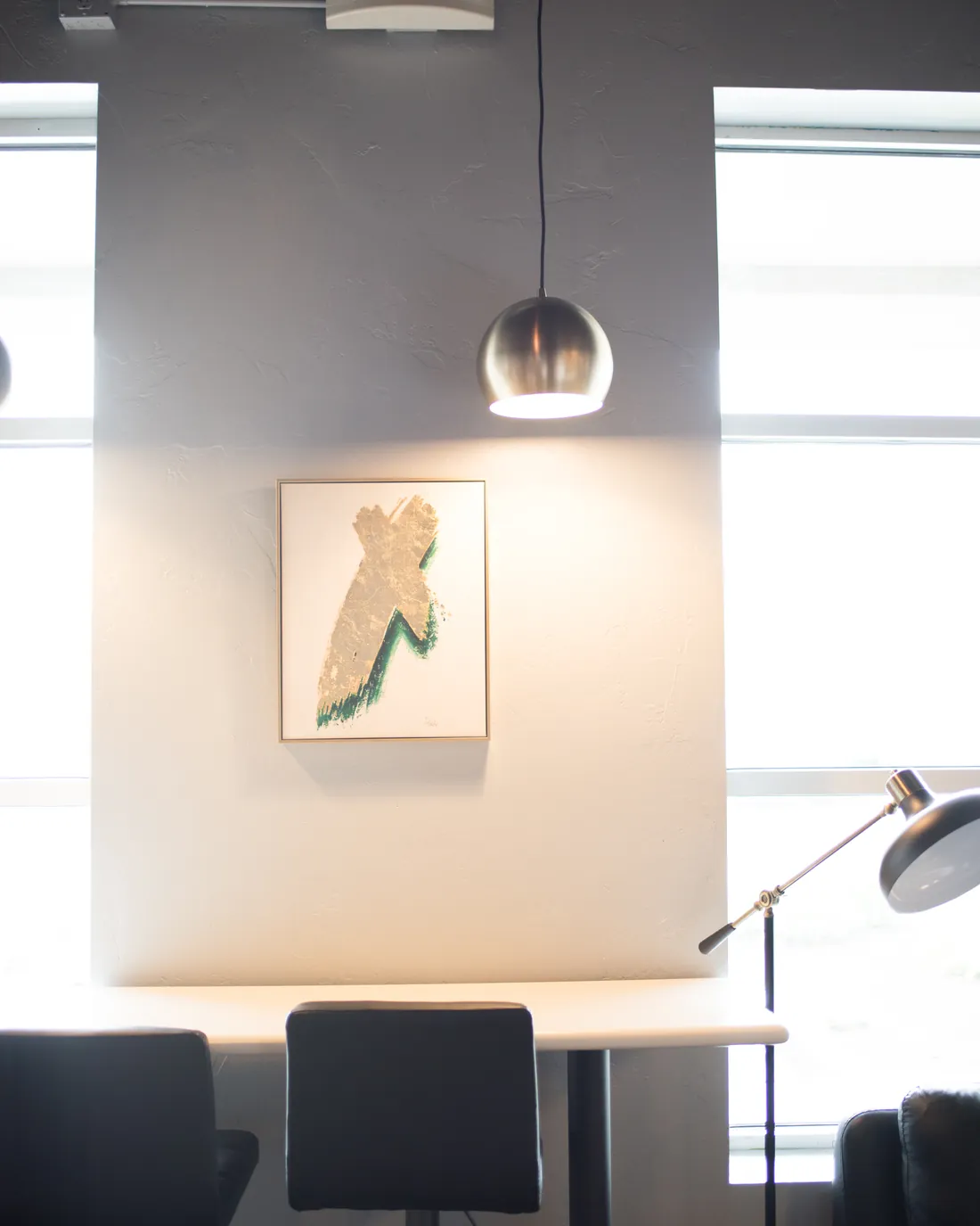 Framed art and warm lighting inside Pique Thai