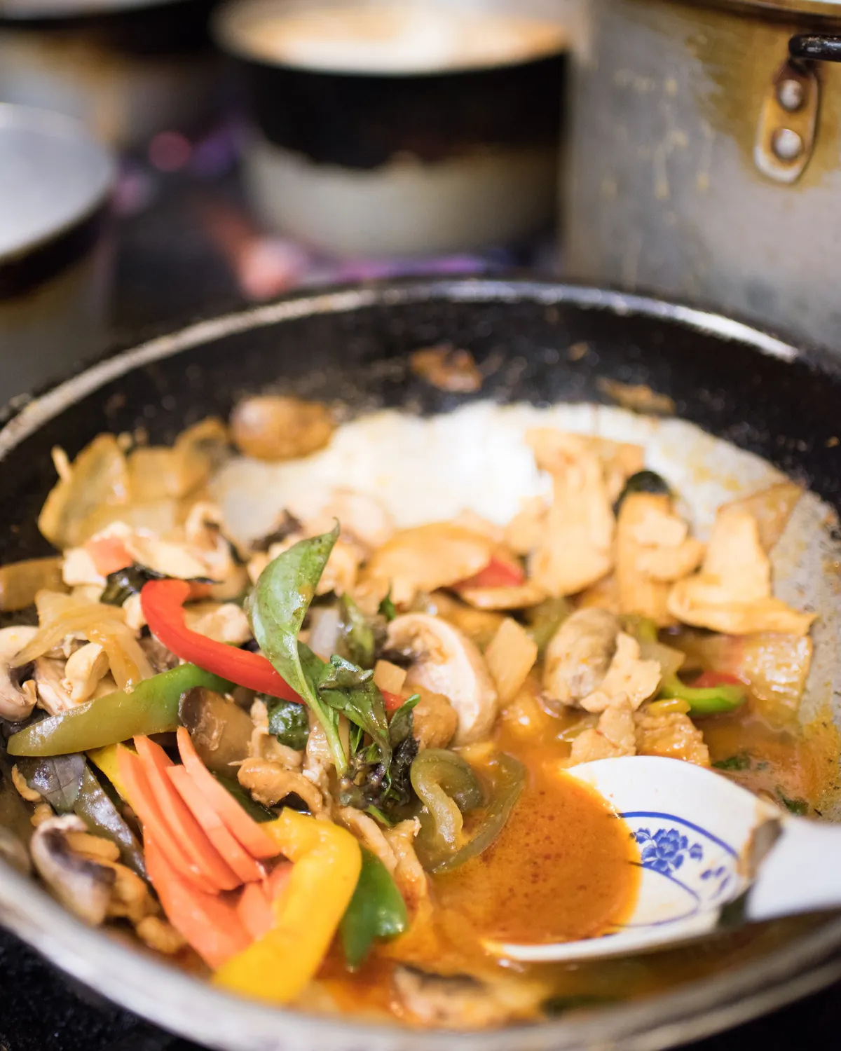 Fresh Thai ingredients being cooked in the Pique Thai kitchen